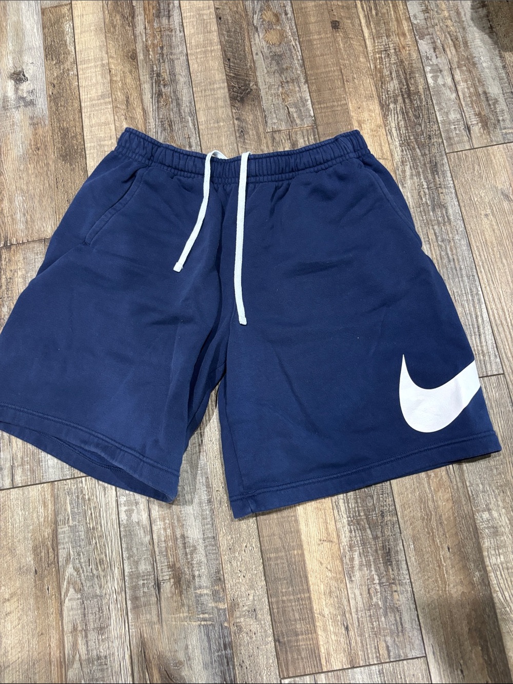 Nike Men's Navy Shorts with White Swoosh